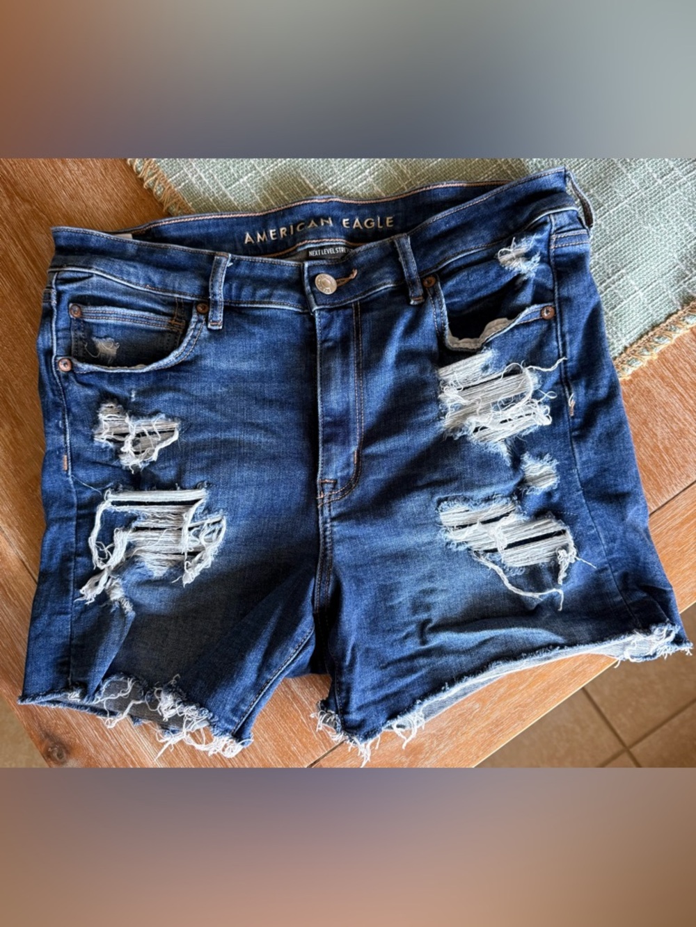 American Eagle Next Level Stretch Distressed Dark Blue Denim Shorts in size 12